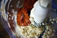 a food processor filled with meat and other ingredients to make an enchilada