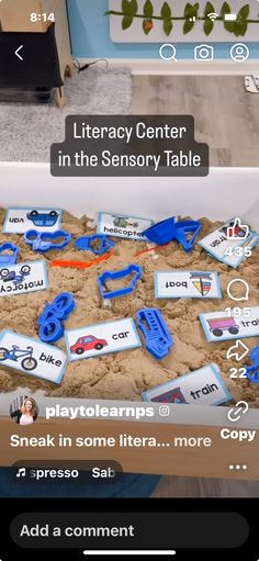 a sandbox filled with blue plastic toys and words that spell out the word play to learn