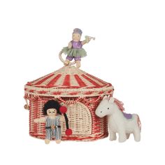 a small toy horse next to a red and white basket with a girl on top