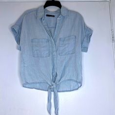 Brand: Black Tape Style: Nwot Relaxed Fit Denim Button Down, Tie Front Shirt Size: Xs Color: Light Denim Wash Material: 100% Tencel Any Questions, Feel Free To Ask! New Items Are Added Every Week. Will Ship Same Or Next Day. :) Add To Bundle For A Discount. Comes From A Smoke Free/Pet Free Home. Please Note All Sales Final. Black Tape Delivers An Updated Classic Style With This Petite Button-Front Shirt Featuring Self Ties At The Hem. * Relaxed Fit; Approx. 18-1/2" Long * Designed To Fit And Fla Washed Blue Chambray Button-up Top, Light Wash Short Sleeve Denim Top With Buttons, Light Wash Denim Top With Short Sleeves And Buttons, Light Wash Denim Top With Short Sleeves, Light Wash Denim Blouse With Button Closure, Casual Medium Wash Blouse With Button Closure, Casual Blouse With Button Closure In Medium Wash, Casual Medium Wash Button-up Blouse, Trendy Light Wash Shirt With Buttons