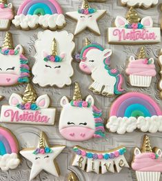 decorated cookies in the shape of unicorns and rainbows