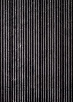 black and white striped wallpaper with vertical lines on the bottom, as an abstract background