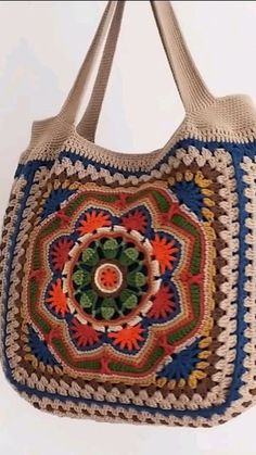 a crocheted bag hanging from a hook