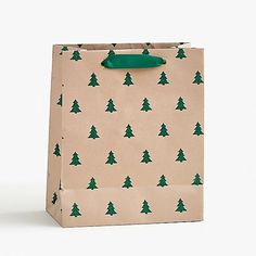 a brown paper bag with green trees on it