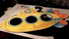 a yellow submarine shaped cake sitting on top of a table