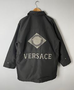 "*ITEM: Vintage Versace Jeans Couture Windbreaker Utility Pocket Jacket Large Versace Medusa Logo Italy Lightweights Coach Windbreaker Bomber Size L *ITEM DETAILS: 👇🏻 Please be aware that all vintage items will usually show a few signs of wear or fading due to age, but anything visible such as stains or holes, and serious flaws have been photographed.For any further information on this item please contact us and we will be happy to help. *SIZE: LARGE *ACTUAL SIZE MEASUREMENT: 👇🏻 *PIT TO PIT( Luxury Streetwear Outerwear With Pockets, Luxury Outerwear With Pockets For Streetwear, Vintage Versace, Button Jacket, Pocket Jacket, Versace Jeans Couture, Versace Jeans, Jacket Buttons, Dhl Express