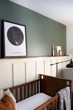 a baby's crib in the corner of a room