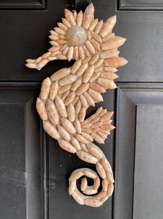 a close up of a door with a seahorse on it