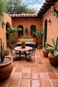 an outdoor patio with potted plants and seating