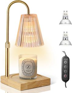 an image of a candle and remote control on a wooden stand with three lamps in the background