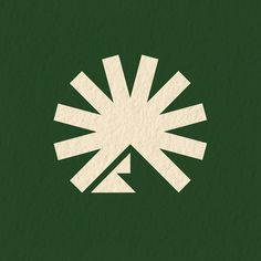 a green background with a white starburst on it's left side and the center part of an arrow in the middle