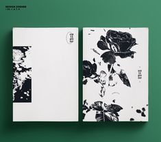 an open book with black and white flowers on it