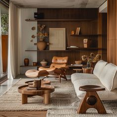 a living room filled with furniture and wooden shelves