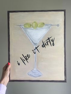 a painting of a martini glass with olives in it and the words life is dirty