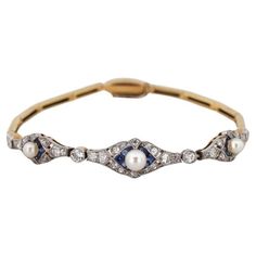 A former bracelet in a geometric Art Deco style from the 1920s. The bracelet is being examined in a gemological laboratory Made of 0.750 yellow gold and platinum. Set with diamonds with a total weight of approx. 0.76ct, sapphires and pearls. A beautiful timeless classic of elegance. Length 15.5cm Weight 9.1g The purchase is accompanied by a jewelry certificate from a gemological laboratory. 1920s Bracelet, Art Deco Jewelry 1920s, Bracelet With Diamonds, Jewelry Certificate, Art Deco Bracelet, Art Deco Stil, Estilo Art Deco, 1920s Art Deco, The 1920s