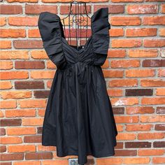 Adorn Yourself With This Ruffle Sleeve Mini Dress! Crafted With Lightweight Material And Featuring Ruched Detailing At The Bust, Smocking At The Back And Discreet Side Pockets, This Dress Is As Stylish As It Is Comfortable. The Perfect Way To Feel Cute And Flirty, You'll Be Sure To Make A Statement In This Charming Black Mini! Never Worn! Brand: Sunland17 Style: Ruffled Strapped Mini Dress Size: Small Color: Closure: Front Zipper Lined: Yes Condition: New Without Tags Flaws: None Material: See T Black A-line Dress With Ruffles, Black Mini Dress With Ruffled Straps, Black Fitted Dress With Ruffled Straps, Black Ruffled Dress For Summer, Black Summer Dress With Ruffles, Black Mini Dress With Ruffled Straps For Night Out, Black Dress With Ruffled Straps For Night Out, Black Mini Dress With Ruffled Hem And Straps, Black Ruched Dress With Ruffled Straps