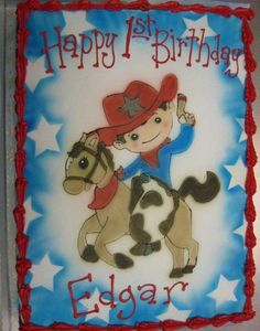 a birthday cake with a cowboy riding a horse on it's side and the words happy 1st birthday edgar written in red, white and blue