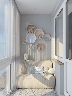 a living room filled with furniture and lots of shelves on the wall above it's windows