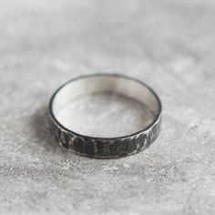 This ring is a unique opportunity to carry a hidden message with you every day. It can be personalized outside (the message will be hidden under the hammered texture) or inside the band (and you'll see the message only taking off the ring). Please, don't forget to add the word / date / phrase you want to be on the ring in the message to seller field during check out. The ring is 1 mm thick and 4 mm wide. Each letter on the ring is hand stamped and gives a fetching feel of a handmade piece. Thoug Sterling Silver Hammered Engraved Promise Ring, Hammered Sterling Silver Engraved Promise Ring, Hammered Sterling Silver Promise Ring, Meaningful Sterling Silver Rings With Engraving Option, Hidden Messages, Hidden Message, Ring Sterling Silver, Slovakia, Sterling Ring