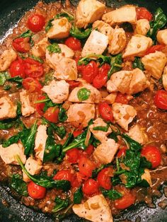 a pan filled with meat and vegetables on top of a stove