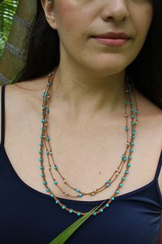 "Super-cute minimalist layered necklace - one is natural braided waxed cotton cord with turquoise faceted beads. The second necklace is long and hand-knotted with tiny, precious sterling silver beads. You have dual looks - wear the long necklace long for a dramatic effect, or doubled for a layered look. Details for both necklaces: * Handmade * Necklace lengths: 22\" and * Closure: * Style: Bohemian, beachy, summery" Adjustable Multi-strand Turquoise Necklace Gift, Turquoise Multi-strand Hand Wrapped Jewelry, Everyday Handmade Multi-strand Jewelry, Turquoise Multi-strand Jewelry With Tiny Beads, Adjustable Hand Knotted Lariat Beaded Necklace, Bohemian Turquoise Jewelry On Waxed Cord, Adjustable Hand Wrapped Necklaces For Layering, Bohemian Turquoise Jewelry With Waxed Cord, Bohemian Jewelry In Turquoise With Waxed Cord