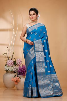 Elevate your ethnic wardrobe with this Exquisite Handwoven Banarasi Saree, a masterpiece of traditional Indian craftsmanship. Made from premium quality silk, this saree features intricate Zari work that showcases the rich cultural heritage of Banaras. Perfect for weddings, festivals, and special occasions, this Banarasi saree exudes elegance and sophistication. Each saree is meticulously handcrafted by skilled artisans, ensuring that every piece is unique and of the highest quality. The luxurious silk fabric drapes beautifully, providing a timeless and graceful look. The rich colors and detailed patterns make this saree a standout choice for any festive celebration or formal event. Saree Type: Banarasi Handloom Pure Silk Antique Zari Kaduwa Butta and Borders Sarees Saree Length: 5.5 Meters Semi-stitched Slub Silk Traditional Wear, Slub Silk Traditional Wear With Zari Work For Ceremonies, Festive Slub Silk Traditional Wear For Ceremonies, Transitional Traditional Wear With Traditional Patterns, Blue Slub Silk Traditional Wear For Puja, Slub Silk Saree With Traditional Patterns, Festival Slub Silk Traditional Wear With Traditional Drape, Semi-stitched Paithani Silk Traditional Wear For Eid, Festivals Traditional Drape In Slub Silk