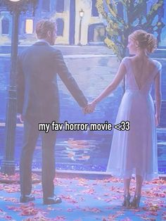 a man and woman holding hands in front of a clock tower with the words my fav horror movie 33