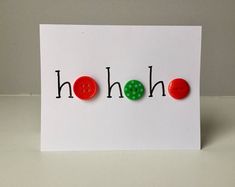 a white card with red and green buttons that spell ho hohoh on it