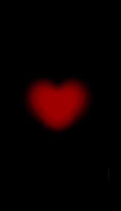 a red heart on a black background