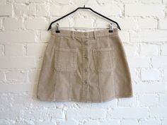 Light Brown Beige Womens Skirt Corduroy Mini Skirt Brown A Line Skirt Buttons Down Skirt Hippie Boho Skirt Medium Size N.B. Color may slightly differ from picture. Label size: L, EUR 42, estimated size: M Measurements (taken laying flat): Waist: 15.5" / 39.5 cm Hips: 21" / 53.5 cm Length: 16" / 40.5 cm Please check measurements to insure a proper fit. Remember to allow yourself some extra room for movement. You can compare these with something from your closet that fits you well. Condition: good Corduroy Mini Skirt, Boho Skirt, Skirt Medium, Vintage Vest, Boho Skirts, Line Skirt, Extra Room, Brown Beige, Cotton Lights