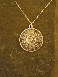 This Moon Sun Astrology pendant is 14K Gold. The included chain is a 14K Gold chain. You may choose 16, 18 or 20 inch at the same price. Other length available at sightly higher prices. This Moon Sun pendant measures 1 1/16" tall by 15/16" across. I hand cast all my pieces using the lost wax casting method. Please ask your needs. You may call me with questions, often I am out so please use my machine. 831-476-3176. Satisfaction Guaranteed! I send items USPS First Class unless otherwise directed. Celestial Engraved 14k Gold Necklace, Engraved Celestial 14k Gold Necklace, Symbolic 14k Gold Necklace With Moon Charm, 14k Gold Sun And Moon Pendant Necklace, 14k Gold Pendant Necklaces With Sun And Moon Design, 14k Gold Moon Charm Necklace, 14k Gold Sun And Moon Round Necklace, 14k Gold Sun And Moon Design Necklace, Symbolic Yellow Gold Necklaces With Sun And Moon Design