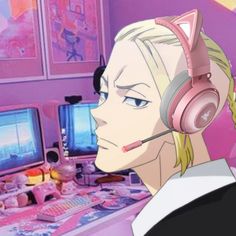 a woman wearing headphones in front of a computer