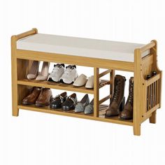 a wooden shoe rack with several pairs of shoes on it