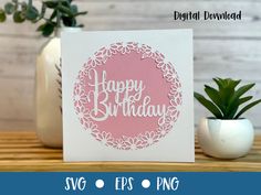 a card with the words happy birthday on it and a potted plant next to it