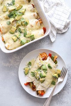 a casserole dish filled with vegetables and topped with parmesan cheese on a white plate