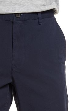 Made from soft four-way-stretch fabric, these slim-tailored chinos feature a curved waistband and a zip pocket for secure storage while you're on the move. 13" leg opening; 10" front rise; 15" back rise Zip fly with button closure Side slant pockets; side zip pocket; back button-welt pockets Moisture-wicking, wrinkle-resistant fabric engineered for dryness and comfort 92% cotton, 8% spandex Machine wash, tumble dry Imported Men's Clothing Navy Business Casual Chinos With Pockets, Navy Casual Chinos With Welt Pockets, Navy Business Casual Chinos, Navy Casual Chinos For Business Casual, Curved Waistband, Welt Pockets, Welt Pocket, Side Zip, Men's Clothing