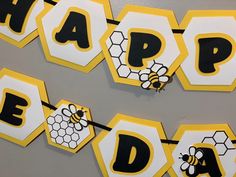 bee happy birthday banner with honeycombs and bees on yellow, black and white paper