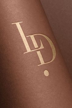 a close up of a wine bottle with the letter d on it's side