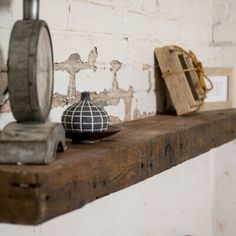 an old wooden shelf with various items on it