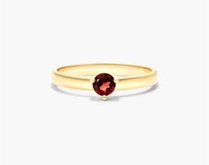 This 14K yellow gold 2.3mm garnet solitaire birthstone ring is a beautiful and unique piece of jewelry. The garnet is a January birthstone and is said to represent love, passion, and protection. This ring is made from high-quality materials and is sure to last for years to come. The ring features a 2.3mm garnet gemstone set in a 14K yellow gold solitaire setting. The ring is available in a variety of sizes to fit any finger. It is also available in a variety of birthstones, so you can find the p Classic Garnet Birthstone Ring In Yellow Gold, Classic Yellow Gold Garnet Birthstone Ring, Yellow Gold Garnet Solitaire Jewelry, Yellow Gold Garnet Birthstone Ring, Garnet Birthstone Ring In Yellow Gold, Petite Rings, Yellow Gold Solitaire, Solitaire Setting, January Birthstone