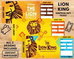 the lion king ticket card is shown on a wooden table with other tickets and stickers