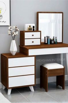 a white and brown dresser with drawers, mirror and stool