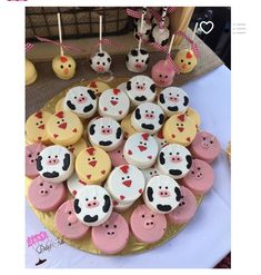 there are many cupcakes that have been decorated with animals on them and hearts