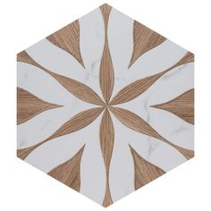 a white and brown hexagonal tile with an intricate design on it's surface