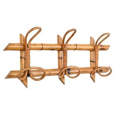 a wall mounted bamboo rack with four hooks