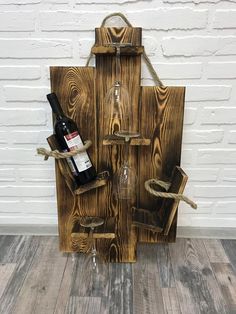 a wine bottle holder made out of wooden planks