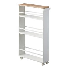 a white book shelf with wheels and a wooden top