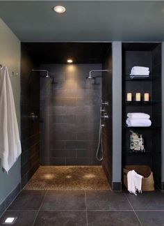 a walk in shower sitting inside of a bathroom