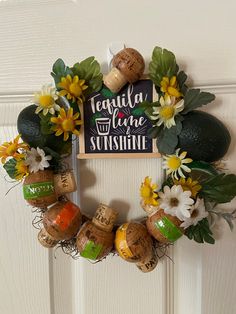 a wreath made out of wine corks and flowers