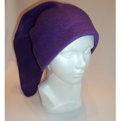 a white mannequin head with a purple hat on it's headband